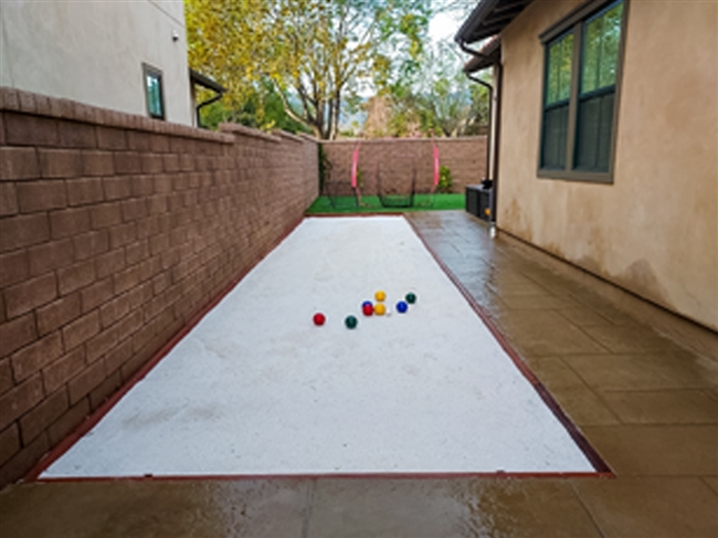 Bocce court shoe cleaner with base